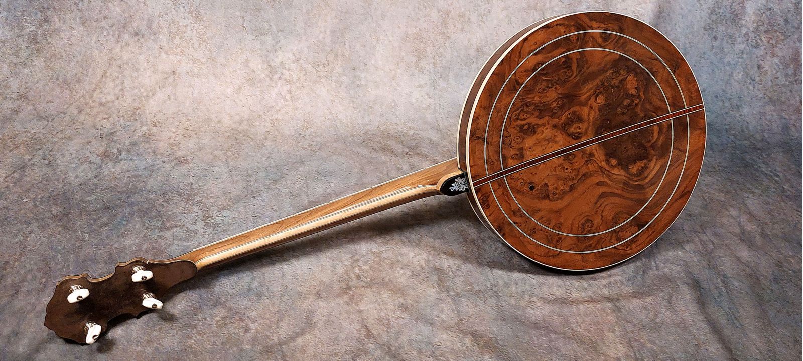 Rioga Deluxe Irish tenor banjo with burl walnut resonator, 5 piece walnut and maple neck, cast tone ring made in Ayrshire